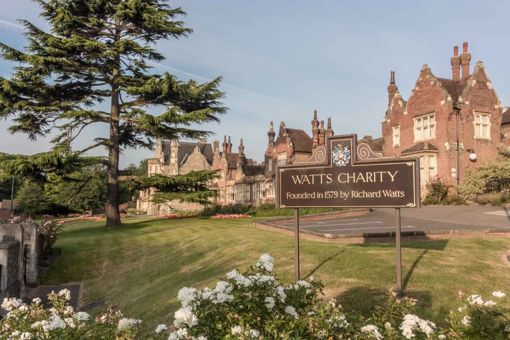Watts Almshouse With Sign